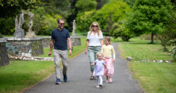 Family walking along the path in Johnstown Castle gardens