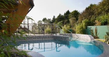 Outdoor plunge pool surrounded by trees at Solas Croí Spa